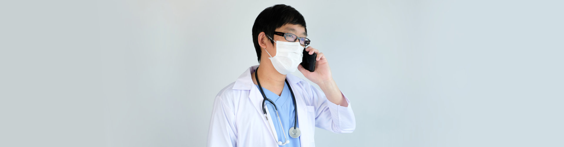 a male doctor on a phone