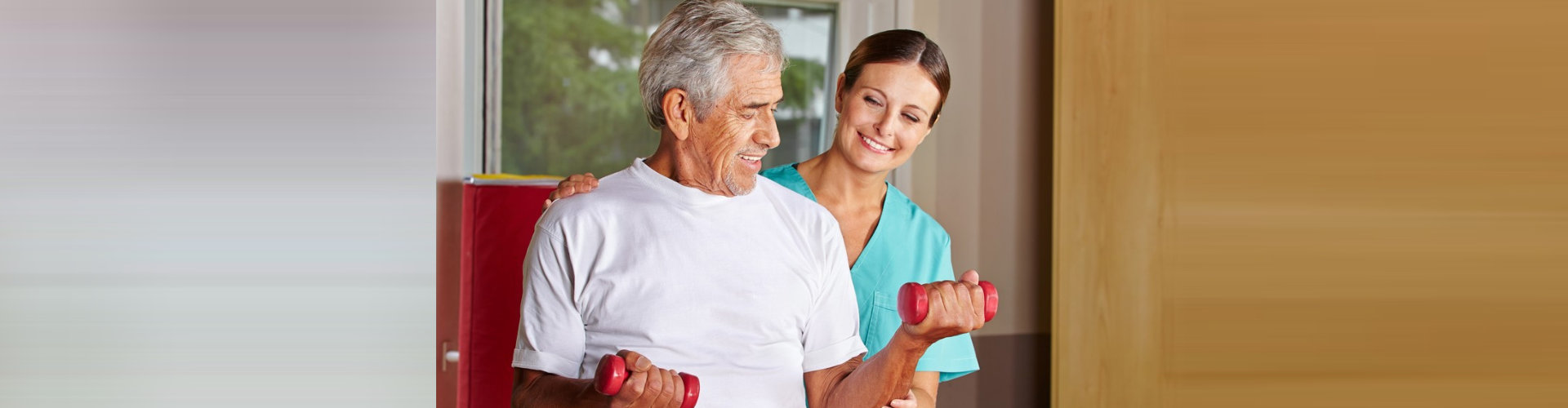an elderly man exercising with a female nurse