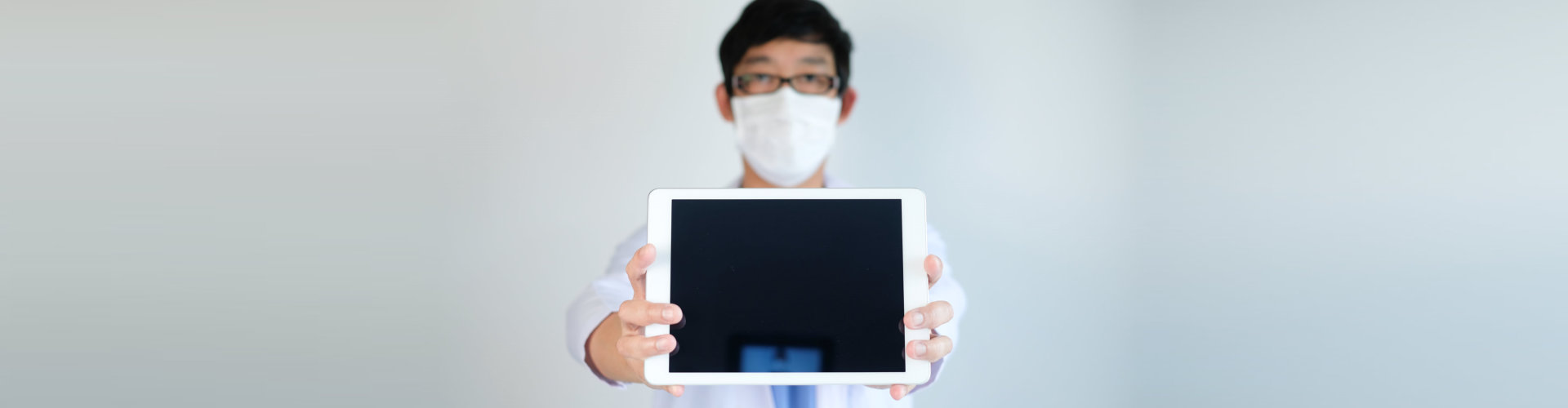 a doctor holding a tablet